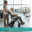 Man pushing an elderly man in a wheelchair with a flip-up leg rest feature, set against an airport background.